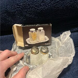 Vintage “House Brand" salt and pepper shaker set with a silver-plated tray